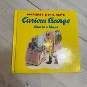 Curious George goes to a movie hardcover book